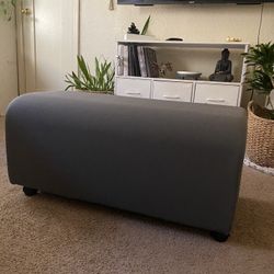 gray ottoman 