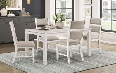 Elegant dining set features contemporary farmhouse style in antique white finish