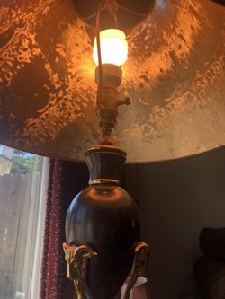 Black lamp shade is gold inside