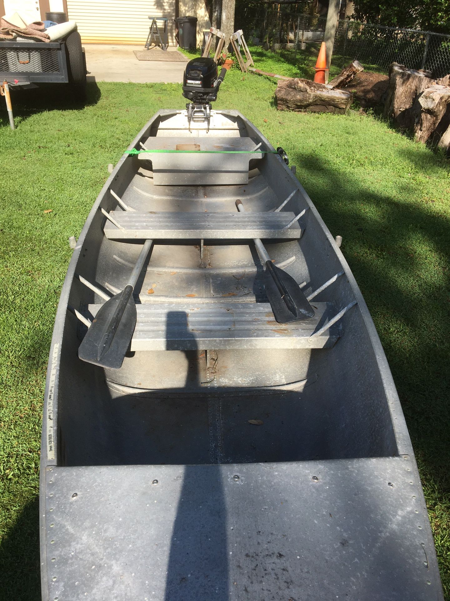 15’ Gruman aluminum Gheenoe with early 1990’s model 9.9 Mercury. Good used condition for Sale in