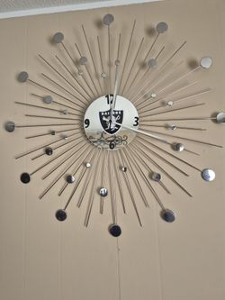 Chrome Wall Raiders Clock, Good Working Condition, $50.00.