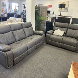 Power Reclining Sofa And Loveseat In Grey Leather 
