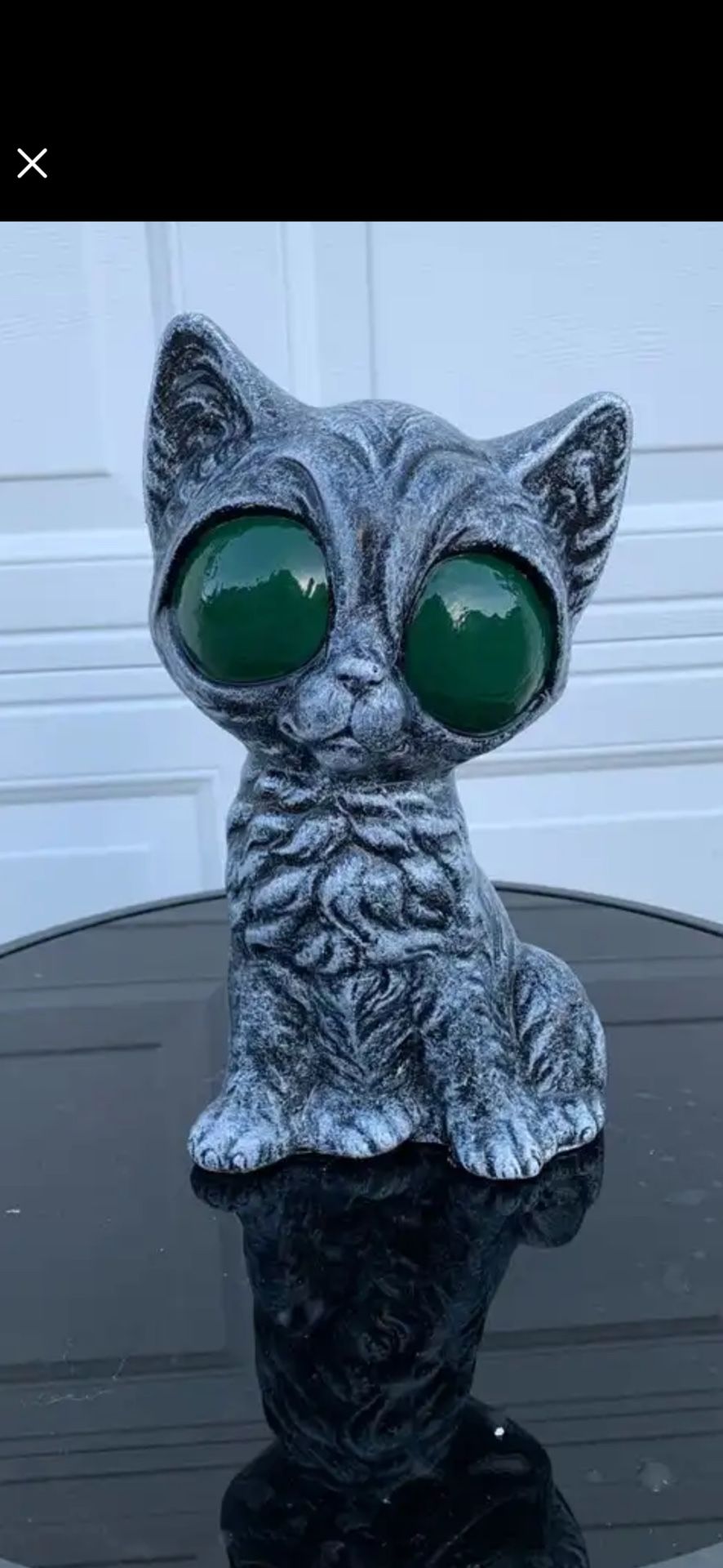 The Big Green Eyed Kitty Statue