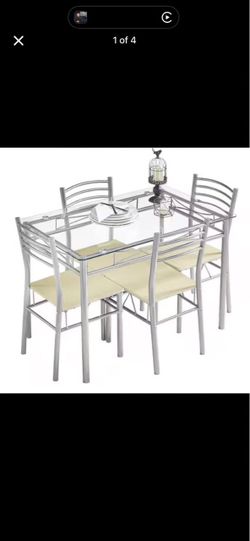 Glass table and 4 chairs -new in box