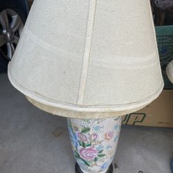 Lamp  blue in back ground and many different color flowers$10. no chips no cracks!
