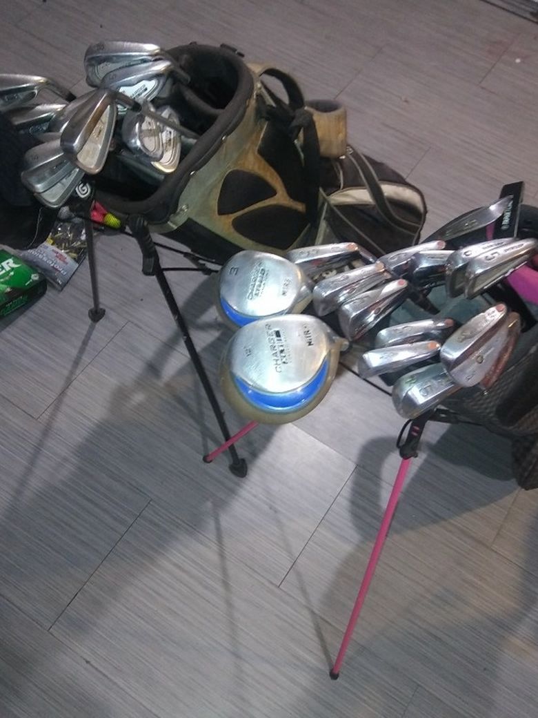 Taylormade And Nike Golf Bags With Clubs
