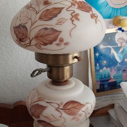 This is a vintage "Gone With The Wind" style hurricane lamp, featuring a milk glass body with hand-painted Set Of 2