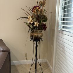 Faux Flower Arrangement On Black Iron Stand