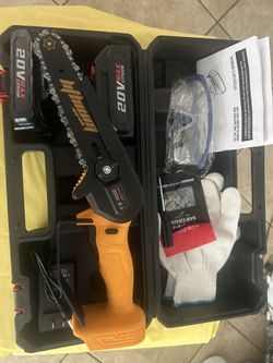 New 6 inch mini chainsaw it comes with two batteries, safety gloves, and safety glasses