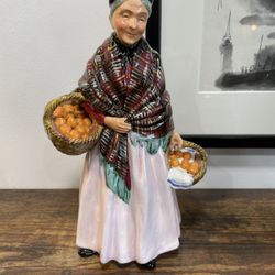 Royal Doulton highly collectible figurine “The Orange Lady”. 