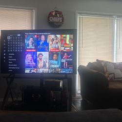 65 Inch Phillips 4K Smart Tv  With Black Glass Tv Stand