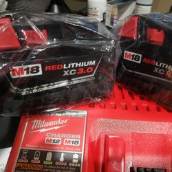 2 MILWAUKEE M18 LITHIUM XC  3.O BATTERY. AND CHARGER, NEW 