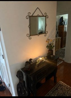 Decorative wrought iron wall mirror with elegant scrollwork. Measures 18” × 18”. Heavy, sturdy, and in excellent condition. Ready to hang. Cash only.