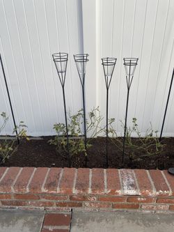 Four Black Garden Stakes with Tea Light Cups, about 48” tall