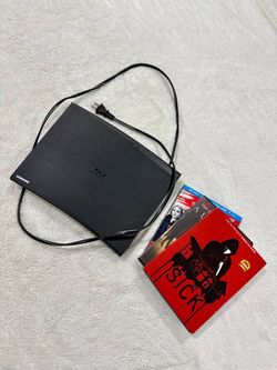 Samsung blu-ray player excellent condition barely used! remote included with extra dvd movies and blu-ray for free