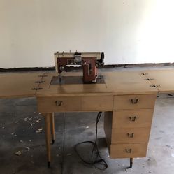 Antique sewing machine and cabinet