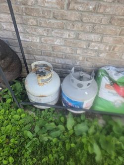 Two empty 20 gal propane tanks