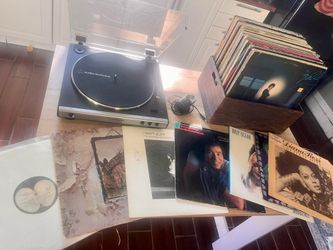 Audio Technica record player with box of 100 vinyl records