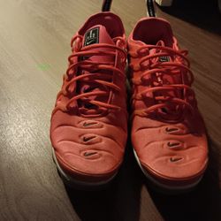 Nike Air VaporMax Plus shoes in a Bright Crimson colorway.