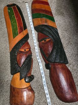 A pair of Vintage Jamaican Rastafarian Hand-Carved Wood Wall Masks