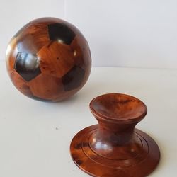 Thuya wood soccer balls and stands.