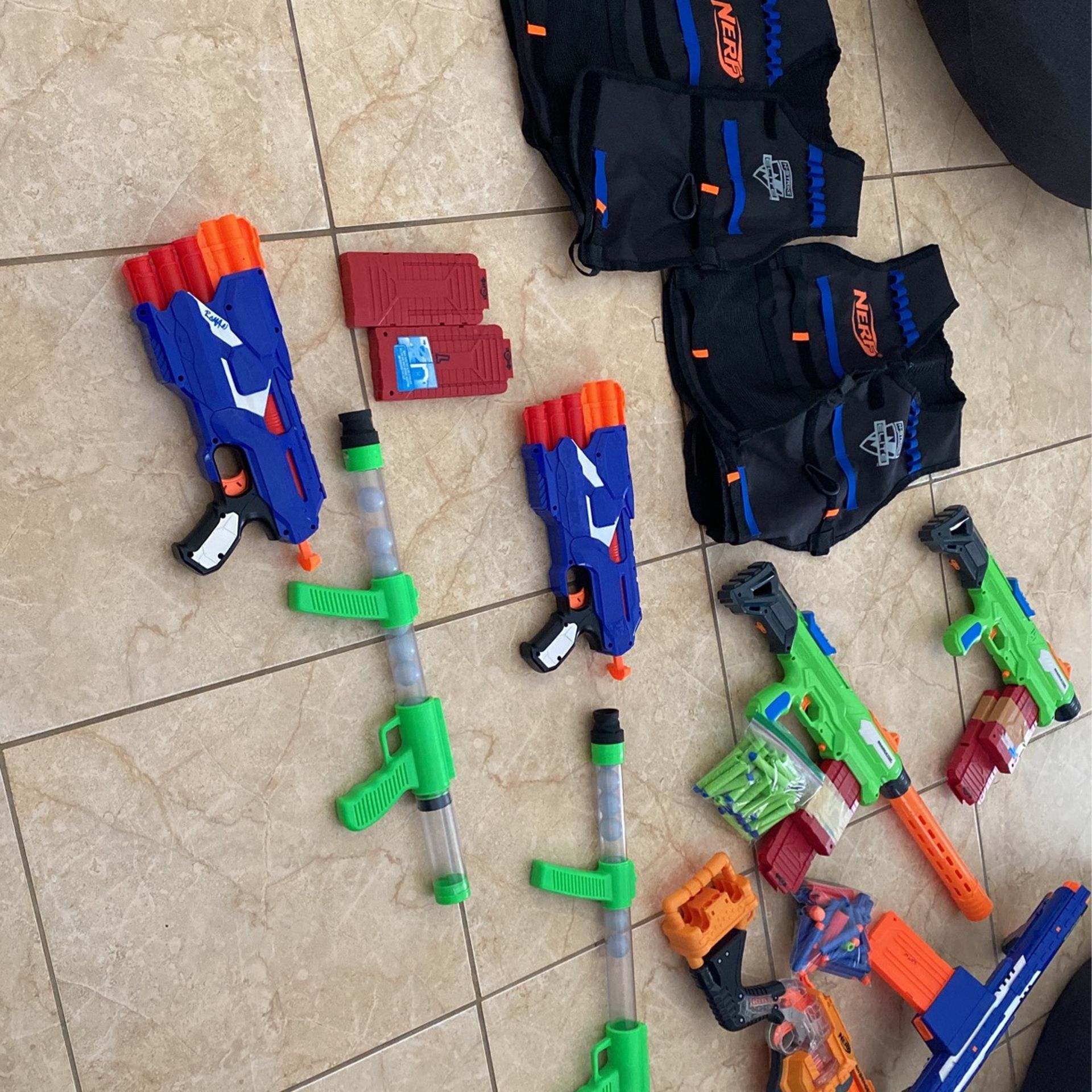 A Bunch Of Nerf Guns And Some Darts