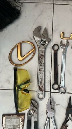 Tools and Lexus car, logos, and dent pullers all for 20