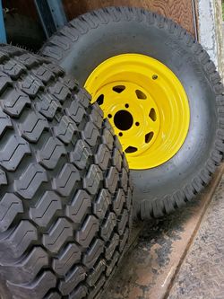 Pair of 26x12.00-12NHS Kenda Turf 505, 4 Ply lawn mower tires mounted on 4-Lug JD yellow wheel