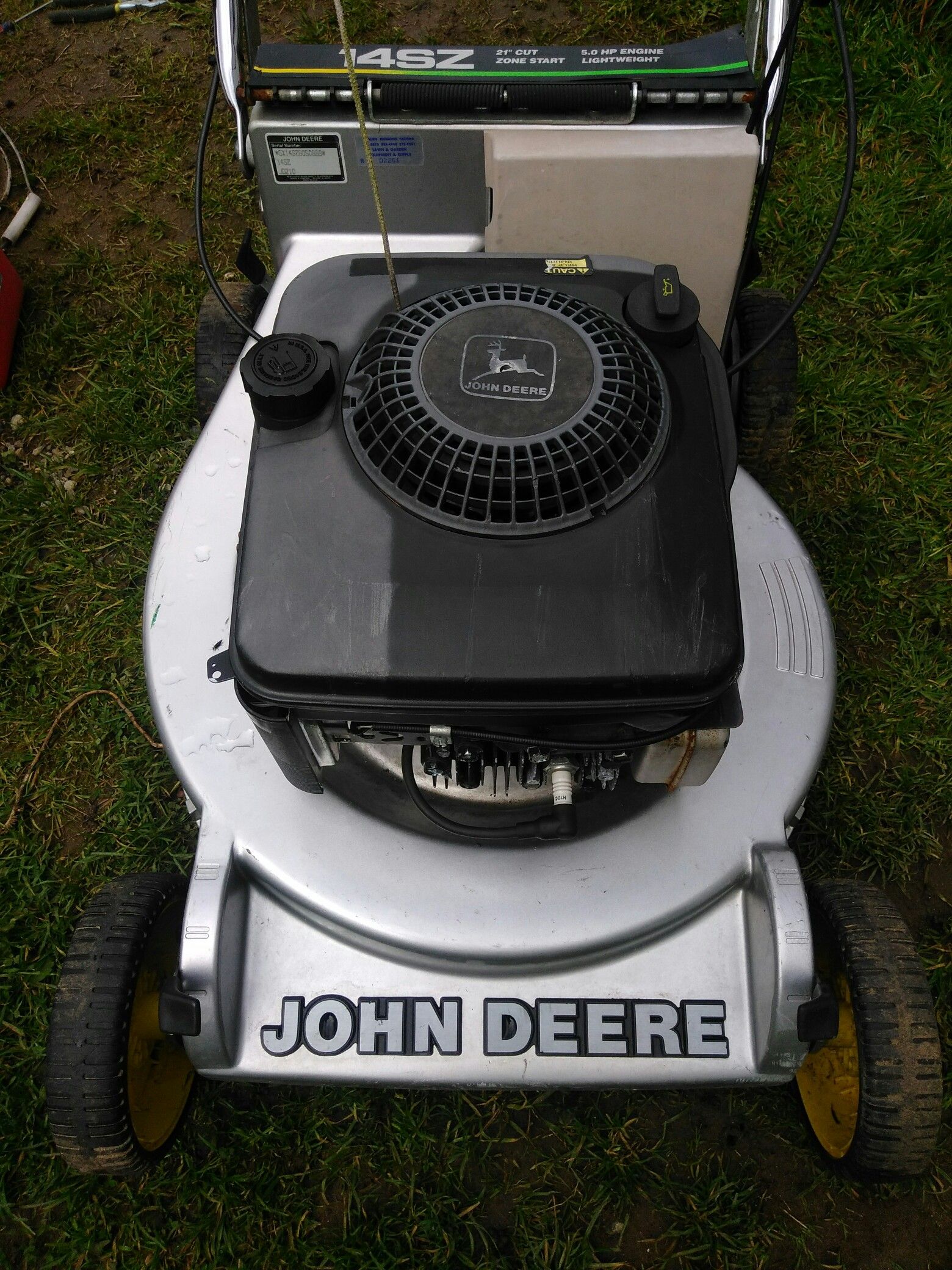 John Deere 14SZ 5 horsepower lawn mower with bag.