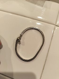 Set of 4 Silver-Tone Twisted Bangle Bracelets - $10