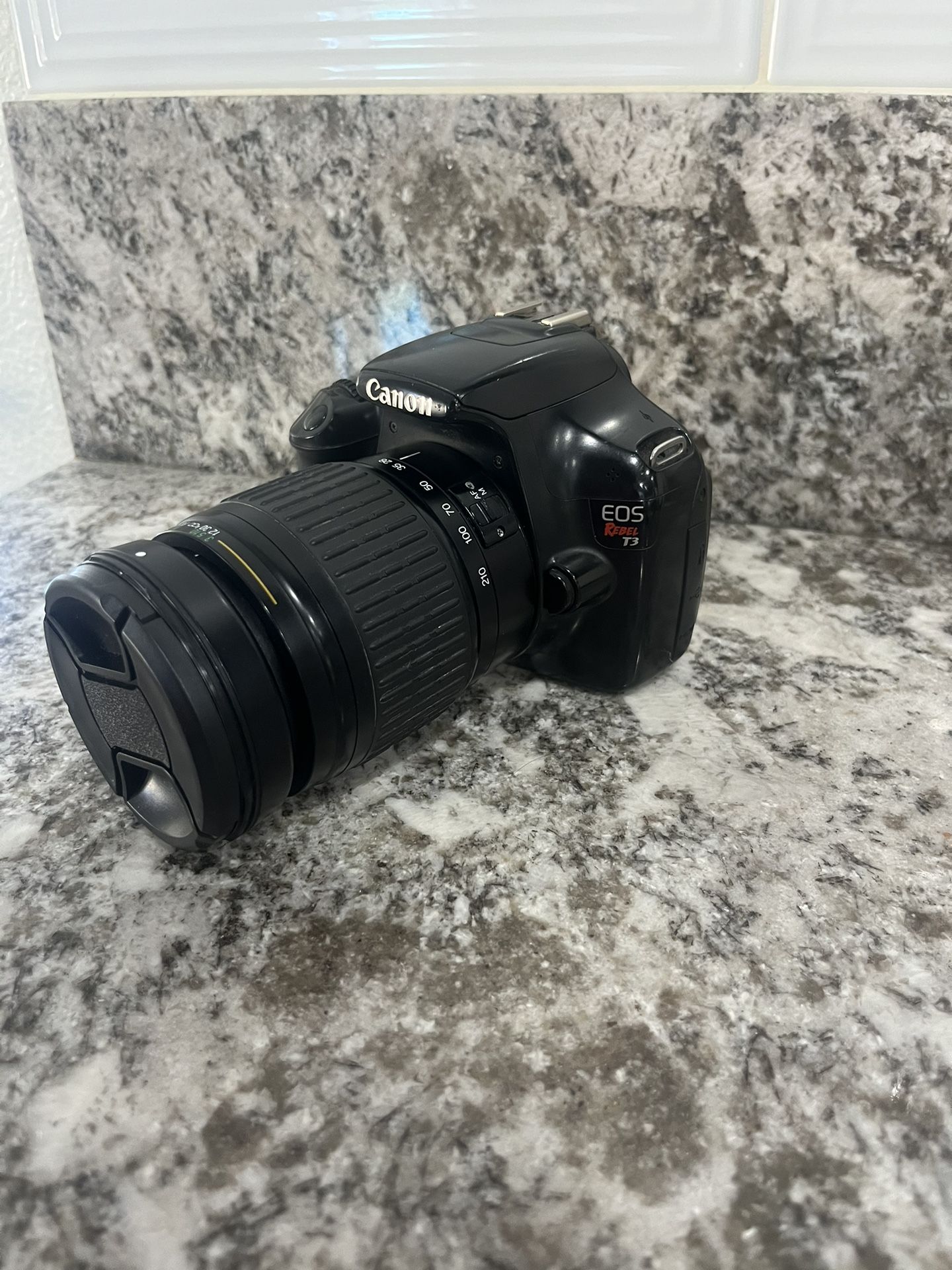 Canon EOS Rebel T3 camera with a Cosina 28-210mm f/4.2-6.5 IF Aspherical lens.