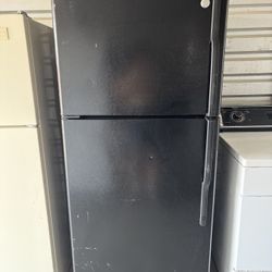 Black GE Refrigerator And Freezer