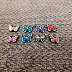 BUTTERFLY CROC CHARMS.  ALL 8 FOR $6. NEW. PICKUP ONLY.