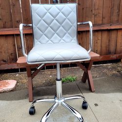 Small adjustable height chair.