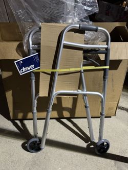 Drive Medical 10210-1 two-button folding walker with wheels.