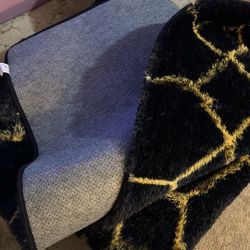 Rug black with gold stripe