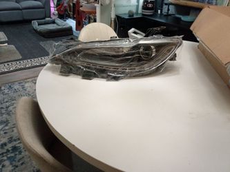 2015 through 2017 Chrysler 200 left headlight