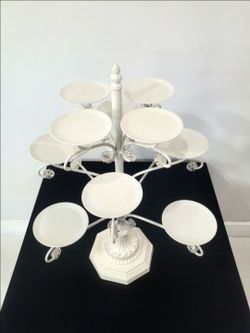 Midwest CBK twelve-tiered cupcake stand. This stand features a French Provençal-inspired, candelabra-style design in a pearl-white finish. It includes