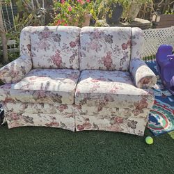 Free  loveseat has been outdoors