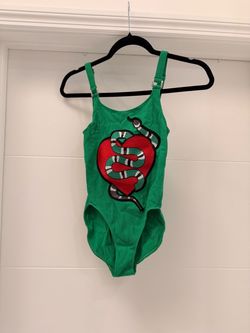 Green open back bodysuit