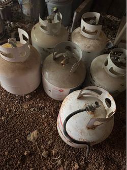 6 propane tanks  more off the half full