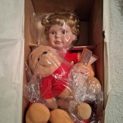 The Ashton-Drake Galleries - Porcelain Doll
"Let's play patty-cake Pooh!"