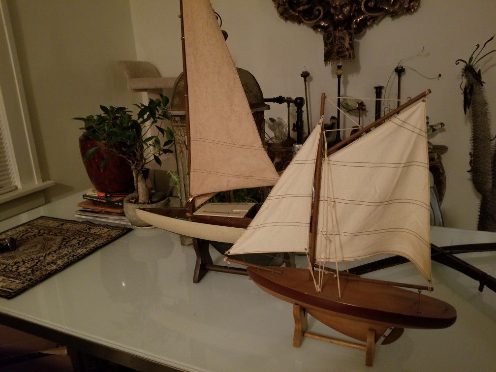 2 wooden sailboats