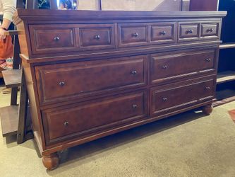 Wide Warm Tone 7-Drawer Dresser w/ Bun Feet