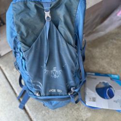 REI hiking bag & portable water reservoir