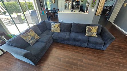 Navy Blue Sectional with 3 throw pillows