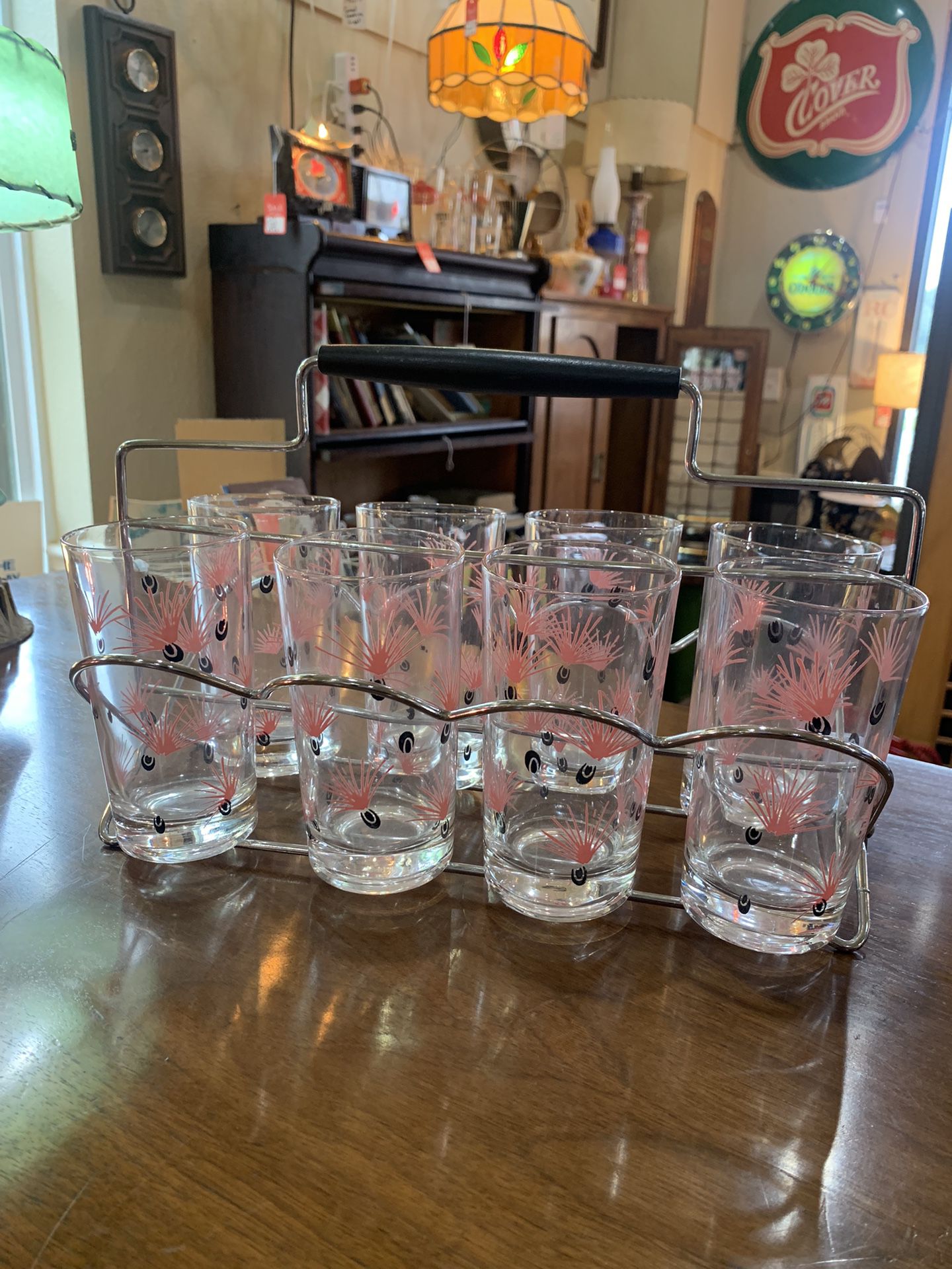 5 inch high authentic pink MID-CENTURY MODERN set of glasses and original carrier. 129.99.  Johanna at Antiques and More. Located at 316b Main Street 