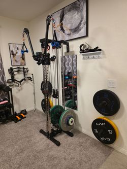 Functional trainer home gym with Adjustable arms and Olympic weight plates