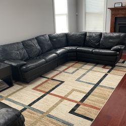 Black Leather Sectional, Love Seat and Two Ottomans