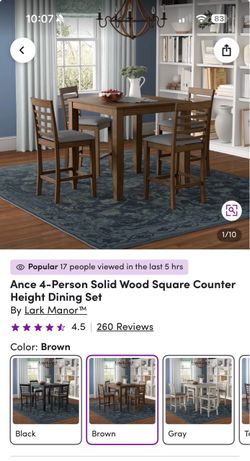 Brand new counter height table with 4 chairs . Still in box
